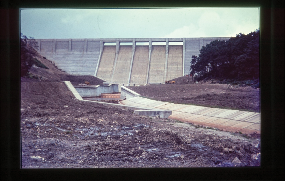 A shot of the dam wall at Thruscross reservoir shortly ­after completion around 1966. While the masonry is completed, the rubble and mud in the foreground suggest work has not long been completed.