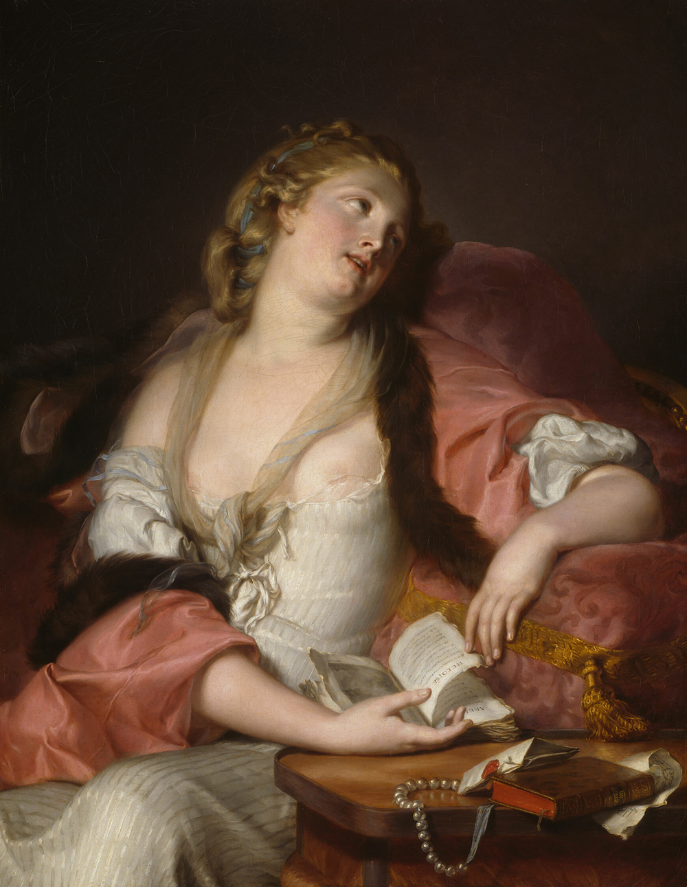A young woman lost in reverie after reading the letters of the medieval lovers Heloise and Abelard.
